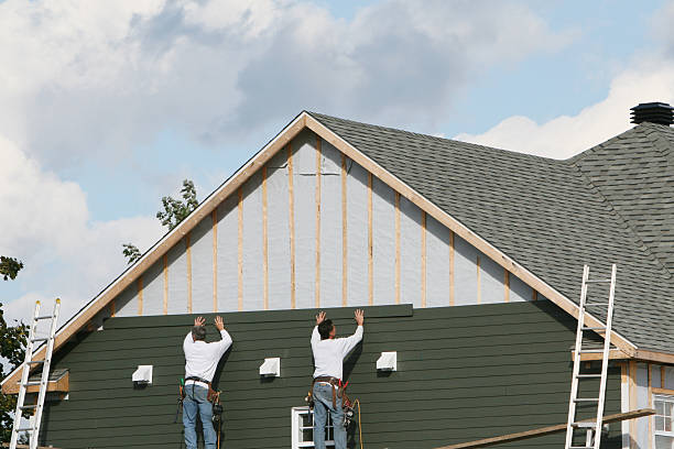 Professional Storm Damage Siding Repair technician working in Norfolk, MA